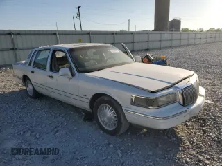 1996 Lincoln Town Car Signature with VIN 1LNLM82WXTY654457, listed as a Copart auction lot 53097635 with 257,446 mi miles and Salvage title. Bid and sale history available at DreamBid. Image 4.