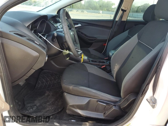2014 Ford Focus SE with VIN 1FADP3F27EL412368, listed as a Copart auction lot 51463155 with 143,484 mi miles and Salvage Title. Bid and sale history available at DreamBid. Image 7.