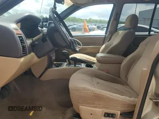 1999 Jeep Grand Cherokee Laredo with VIN 1J4GW58N7XC799434, listed as a Copart auction lot 64790905 with 272,384 mi miles and Salvage title. Bid and sale history available at DreamBid. Image 7.