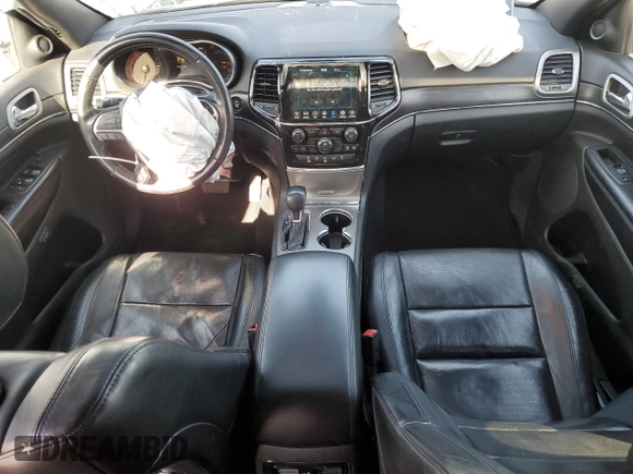 2021 Jeep Grand Cherokee 80th Anniversary with VIN 1C4RJFBG7MC665757, listed as a Copart auction lot 52443235 with 99,828 mi miles and Salvage Title. Bid and sale history available at DreamBid. Image 8.