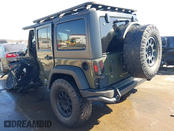 2015 Jeep Wrangler Unlimited Rubicon with VIN 1C4BJWFG0FL623431, listed as a IAAI auction lot 41651317 with 105,508 mi miles. Bid and sale history available at carsss.com. Image 3.