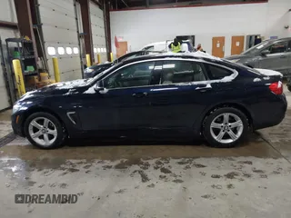2015 BMW 4 Series 428i xDrive with VIN WBA4A7C57FD414955, listed as a IAAI auction lot 41609214 with 69,125 mi miles and . Bid and sale history available at DreamBid. Image 14.