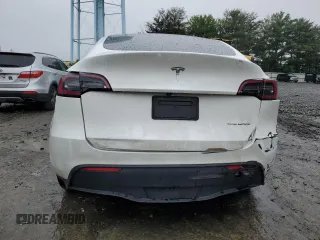2023 Tesla Model Y Long Range z VIN 7SAYGDEE4PF797653, wystawiony jako Copart lot #58668985 z przebiegiem 35 520 mil mil oraz Szkody całkowita. Historia ofert i sprzedaży dostępna na DreamBid. Obrazek 6.