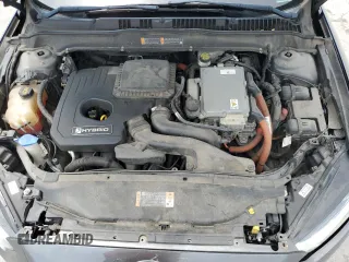 2016 Ford Fusion SE Hybrid с VIN 3FA6P0LU8GR227215, выставлен на аукционе Copart как лот 62669895 с пробегом 249 837 миль миль и Списание • Salvage title. История ставок и продаж доступна на DreamBid. Изображение 11.