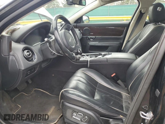 2014 Jaguar XJ Portfolio with VIN SAJWJ2GD4E8V69651, listed as a Copart auction lot 52426195 with 56,413 mi miles and Salvage title. Bid and sale history available at DreamBid. Image 7.