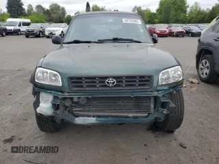 1999 Toyota RAV4 with VIN JT3GP10V2X0037464, listed as a Copart auction lot 54732085 with 306,550 mi miles and Clean Title. Bid and sale history available at DreamBid. Image 5.