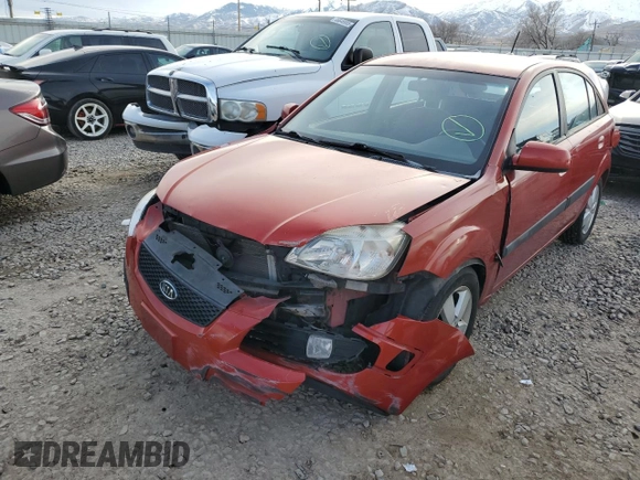 2009 Kia Rio LX with VIN KNADE243X96587429, listed as a Copart auction lot 46500825 with 116,557 mi miles and Salvage Title. Bid and sale history available at carsss.com. Image 1.