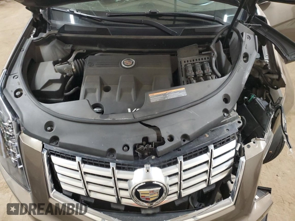 2014 Cadillac SRX Luxury Collection z VIN 3GYFNEE34ES652268, wystawiony jako Copart lot #54136545 z przebiegiem 99 542 mil mil oraz Szkoda całkowita • Salvage title. Historia ofert i sprzedaży dostępna na DreamBid. Obrazek 11.