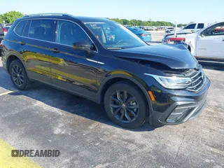 2024 Volkswagen Tiguan SE with VIN 3VVNB7AXXRM199400, listed as a IAAI auction lot 42216941 with 11,581 mi miles and . Bid and sale history available at DreamBid. Image 1.