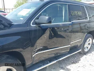 2018 Chevrolet Tahoe LT with VIN 1GNSKBKC7JR245565, listed as a IAAI auction lot 42097400 with 123,709 mi miles and . Bid and sale history available at DreamBid. Image 6.