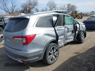 2021 Honda Pilot Elite with VIN 5FNYF6H00MB085678, listed as a IAAI auction lot 41783075 with Not Provided miles and . Bid and sale history available at DreamBid. Image 4.