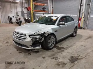 2013 Ford Taurus Limited with VIN 1FAHP2F83DG116657, listed as a IAAI auction lot 41533075 with 124,649 mi miles. Bid and sale history available at carsss.com. Image 2.