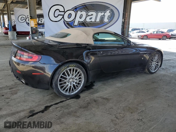 2009 Aston Martin Vantage z VIN SCFBF04CX9GD11858, wystawiony jako Copart lot #53907885 z przebiegiem 87 495 mil mil oraz Szkody całkowita. Historia ofert i sprzedaży dostępna na DreamBid. Obrazek 3.