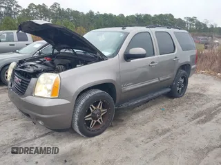 2007 GMC Yukon SLT with VIN 1GKFK13047R288220, listed as a IAAI auction lot 41579399 with 215,464 mi miles. Bid and sale history available at carsss.com. Image 2.