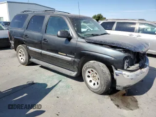 2001 GMC Yukon SLT with VIN 1GKEC13T31J198419, listed as a Copart auction lot 65012144 with 210,431 mi miles and Salvage Title. Bid and sale history available at carsss.com. Image 4.