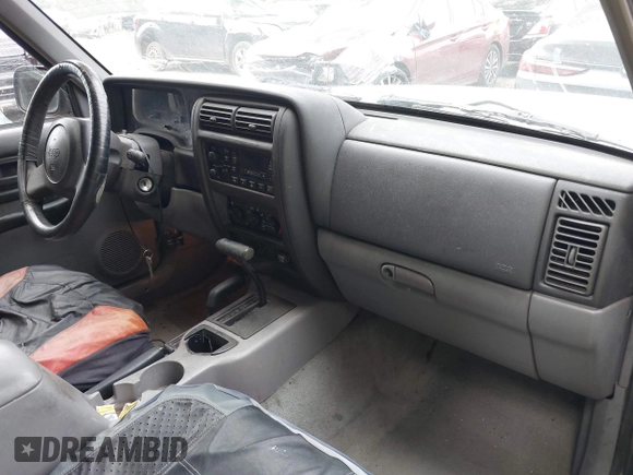 1998 Jeep Cherokee Sport with VIN 1J4FJ68S2WL218474, listed as a IAAI auction lot 42595465 with 184,262 mi miles and . Bid and sale history available at DreamBid. Image 5.