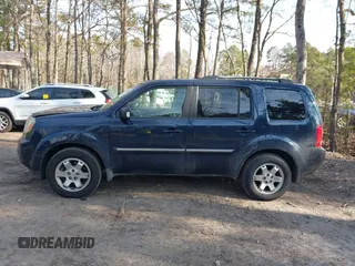 2009 Honda Pilot Touring with VIN 5FNYF48939B007471, listed as a IAAI auction lot 41683495 with 189,806 mi miles and . Bid and sale history available at carsss.com. Image 14.