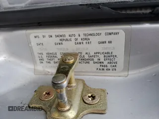2006 Suzuki Forenza z VIN KL5JD56Z76K411376, wystawiony jako Copart lot #82751694 z przebiegiem Nie podano mil oraz Szkody całkowita. Historia ofert i sprzedaży dostępna na DreamBid. Obrazek 13.