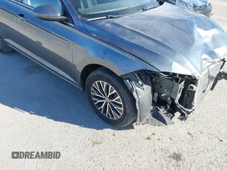 2021 Volkswagen Jetta S z VIN 3VWC57BU8MM098931, wystawiony jako IAAI lot #41818622 z przebiegiem 10 469 mil mil oraz . Historia ofert i sprzedaży dostępna na DreamBid. Obrazek 18.