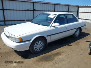 1990 Toyota Camry LE ECT z VIN JT2SV22E1L3427911, wystawiony jako IAAI lot #42040646 z przebiegiem 133 129 mil mil oraz . Historia ofert i sprzedaży dostępna na DreamBid. Obrazek 2.