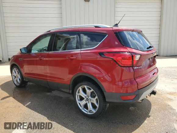 2019 Ford Escape Titanium z VIN 1FMCU0J97KUB20612, wystawiony jako Copart lot #64638415 z przebiegiem 100 102 mil mil oraz Czysty tytuł • Clean title. Historia ofert i sprzedaży dostępna na DreamBid. Obrazek 2.