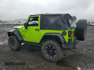 2012 Jeep Wrangler Sport with VIN 1C4AJWAG2CL233722, listed as a Copart auction lot 61125095 with 49,864 mi miles and Salvage title. Bid and sale history available at DreamBid. Image 2.