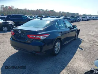 2020 Toyota Camry LE with VIN 4T1C11AK9LU985116, listed as a IAAI auction lot 40798999 with 53,390 mi miles. Bid and sale history available at carsss.com. Image 4.