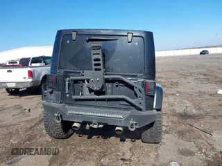 2015 Jeep Wrangler Unlimited Rubicon with VIN 1C4BJWFG9FL755152, listed as a IAAI auction lot 41293766 with 109,153 mi miles. Bid and sale history available at carsss.com. Image 17.