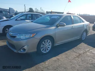2014 Toyota Camry Hybrid LE with VIN 4T1BD1FK8EU097505, listed as a IAAI auction lot 38159878 with 379,573 mi miles. Bid and sale history available at carsss.com. Image 2.