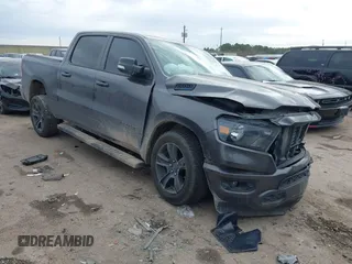 2021 Ram 1500 Lone Star with VIN 1C6RREFT2MN746770, listed as a IAAI auction lot 41360600 with 76,998 mi miles and . Bid and sale history available at DreamBid. Image 1.