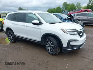 2022 Honda Pilot Touring 7-Passenger with VIN 5FNYF6H63NB086457, listed as a IAAI auction lot 42330249 with 33,813 mi miles and . Bid and sale history available at DreamBid. Image 1.