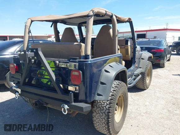 2000 Jeep Wrangler Sport with VIN 1J4FA49S0YP770943, listed as a IAAI auction lot 41817600 with 165,379 mi miles and . Bid and sale history available at DreamBid. Image 4.