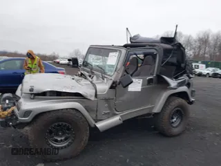 2001 Jeep Wrangler Sport with VIN 1J4FA49S41P355646, listed as a IAAI auction lot 41937746 with 160,634 mi miles. Bid and sale history available at carsss.com. Image 6.