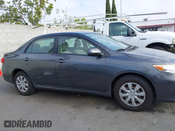 2011 Toyota Corolla L with VIN JTDBU4EE7B9162022, listed as a IAAI auction lot 42066643 with 124,384 mi miles. Bid and sale history available at carsss.com. Image 14.