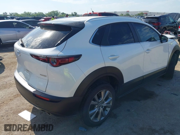 2023 Mazda CX-30 S Carbon Edition with VIN 3MVDMBCM2PM552282, listed as a IAAI auction lot 42241909 with 14,765 mi miles and . Bid and sale history available at DreamBid. Image 4.