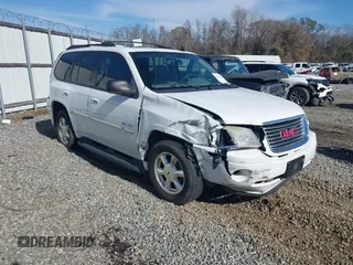 2006 GMC Envoy SLT with VIN 1GKDS13S062128531, listed as a IAAI auction lot 41458983 with 119,385 mi miles. Bid and sale history available at carsss.com. Image 1.