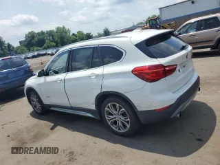 2017 BMW X1 xDrive28i with VIN WBXHT3Z3XH4A55624, listed as a Copart auction lot 59773545 with 140,251 mi miles and Salvage title. Bid and sale history available at DreamBid. Image 2.
