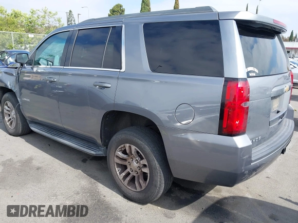 2018 Chevrolet Tahoe LS with VIN 1GNSCAEC2JR306131, listed as a IAAI auction lot 42338873 with 107,652 mi miles and . Bid and sale history available at DreamBid. Image 3.