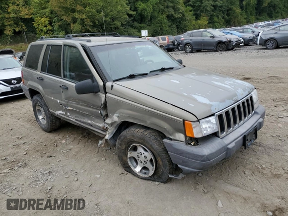 1996 Jeep Grand Cherokee Laredo with VIN 1J4GZ58S7TC403946, listed as a Copart auction lot 71785734 with 231,780 mi miles and Salvage Title. Bid and sale history available at carsss.com. Image 4.