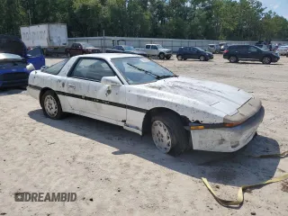 1986 Toyota Supra z VIN JT2MA70L7G0014661, wystawiony jako Copart lot #72161554 z przebiegiem 160 516 mil mil oraz Czysty tytuł • Clean title. Historia ofert i sprzedaży dostępna na DreamBid. Obrazek 4.