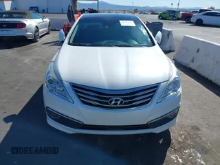 2017 Hyundai Azera Limited z VIN KMHFH4JG9HA579125, wystawiony jako IAAI lot #41718120 z przebiegiem 51 005 mil mil oraz . Historia ofert i sprzedaży dostępna na DreamBid. Obrazek 12.