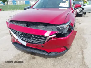 2016 Mazda CX-9 Touring with VIN JM3TCACY4G0112961, listed as a IAAI auction lot 42094718 with 114,679 mi miles and . Bid and sale history available at DreamBid. Image 6.