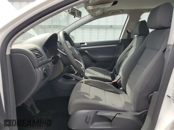 2009 Volkswagen Rabbit S with VIN WVWDB71K79W085935, listed as a Copart auction lot 60697594 with 102,780 mi miles and Salvage title. Bid and sale history available at DreamBid. Image 7.