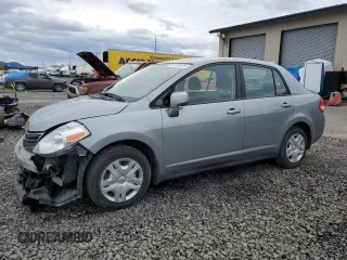 2010 Nissan Versa S with VIN 3N1BC1APXAL411429, listed as a Copart auction lot 50638725 with 95,893 mi miles and Salvage Title. Bid and sale history available at DreamBid. Image 1.