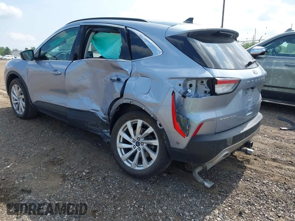 2022 Ford Escape Titanium with VIN 1FMCU9J94NUB57495, listed as a IAAI auction lot 42530044 with 27,075 mi miles and . Bid and sale history available at DreamBid. Image 3.