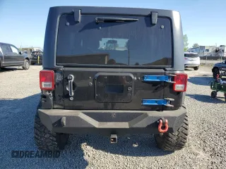 2014 Jeep Wrangler Unlimited Sport with VIN 1C4BJWDG1EL308834, listed as a Copart auction lot 53710065 with 127,612 mi miles and Clean Title. Bid and sale history available at DreamBid. Image 6.