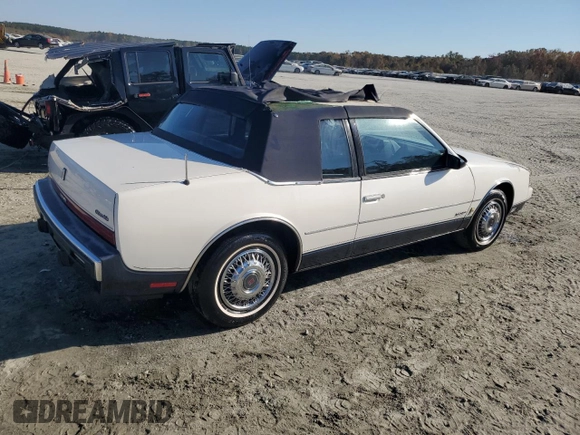 1987 Oldsmobile Toronado with VIN 1G3EZ1130HU307201, listed as a Copart auction lot 78028584 with 104,837 mi miles and Salvage Title. Bid and sale history available at DreamBid. Image 3.