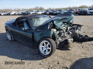 1999 Mazda MX-5 Miata z VIN JM1NB3536X0133733, wystawiony jako Copart lot #50906215 z przebiegiem Nie podano mil oraz Szkoda całkowita • Salvage title. Historia ofert i sprzedaży dostępna na DreamBid. Obrazek 4.