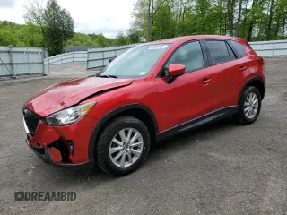 2014 Mazda CX-5 Touring z VIN JM3KE4CY3E0423544, wystawiony jako Copart lot #57633125 z przebiegiem 69 189 mil mil oraz Szkoda całkowita • Salvage title. Historia ofert i sprzedaży dostępna na DreamBid. Obrazek 1.