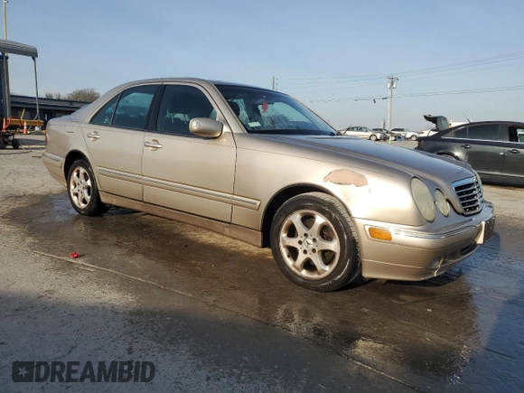 2002 Mercedes-Benz E-Class with VIN WDBJF65J22B490275, listed as a Copart auction lot 51128565 with 142,232 mi miles and Salvage Title. Bid and sale history available at carsss.com. Image 4.